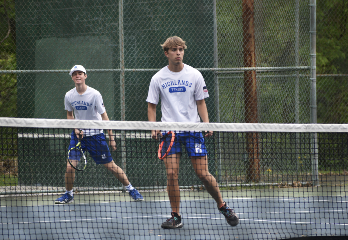 Joe Subach (12) and Josh deSylva (11) work together to win their match. "I was preparing for a big hit," Subach said. 